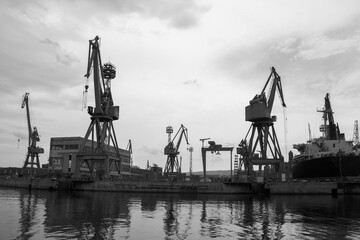 Black and white view of a harbor showcasing industrial infrastructure