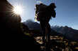 © ADDICTIVE STOCK - Unrecognizable porter carrying heavy load in Nepal