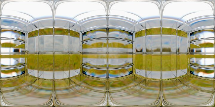 A seamless HDRI environment with a reflective metallic grid structure overlaid on a bright outdoor field. The chrome surface reflects green grass and a blue sky, blending nature with futuristic design