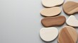 © MdAbirHasan - A collection of organic wood shapes rests on a grey background