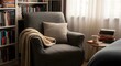 © Digitalin.co - Cozy corner reading nook with armchair and books, A comfortable armchair setup for relaxing and reading with soft light, a bookshelf, and a side table