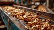 © mila103 - Shiny gold nuggets are scattered along a conveyor belt in a mining facility, showcasing the raw materials being processed during daylight. The setting indicates ongoing extraction activities.