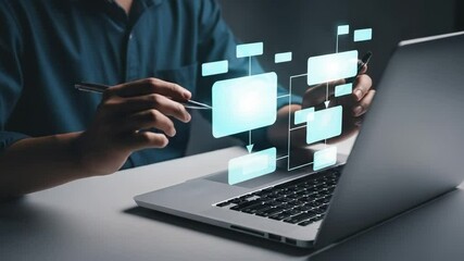 Poster - Person using laptop with flowchart overlay in a dark setting creating a business strategy plan