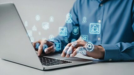 Poster - Person typing on a laptop with digital icons floating above the keyboard and wearing a blue shirt
