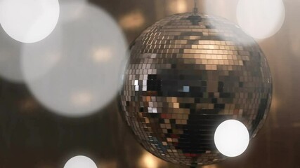 Poster - Light orb drifting in, mirrored disco ball rotating and scattering reflections for bokeh display