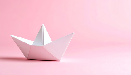 Poster - A simple white paper boat sits on a soft pink background, evoking a sense of childhood nostalgia and creativity