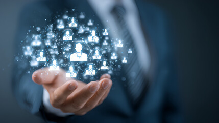 Poster - Businessman holding digital icons of people and team management, representing human resources, recruitment, employee data, business leadership, and digital HR solutions.