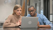 © stockbakers - Video Chat by Young Casual People via Laptop