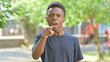 © stockbakers - Angry Casual African Man Pointing and Scolding Outdoors
