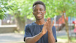 © stockbakers - Appreciating Casual African Man Clapping Outdoors