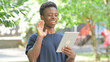 © stockbakers - Casual African Man Making a Video Call on a Tablet