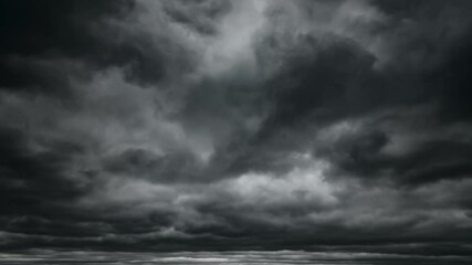 Wall Mural - dark dramatic sky with black stormy clouds before rain as abstract background, extreme weather timel