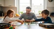 © Handrey - Family board game night at home father and children playing together fun activity quality time bonding happy moments father's day