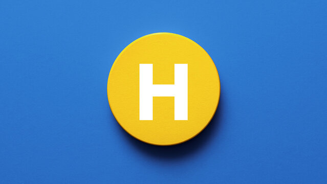 Round wooden disk painted bright yellow with bold letter H centered perfect for alphabet icon signage monogram education learning initial or creative typography lettermark design visuals