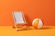 © MS LAIZU - A striped beach chair and colorful beach ball on an orange background