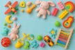 © Ollika - Colorful Children’s Toys Framed on Light Blue Background with Center Space