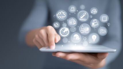 Poster - Person interacts with digital tablet, engaging with floating icons representing various digital learning concepts. image conveys sense of modern technology and innovation
