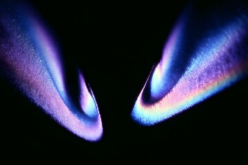 Poster - 
Vintage, grainy gradient from purple to blue, blurry black light waves, close-up of two large