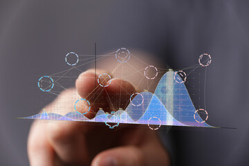 Leinwandbilder - Person interacting with a holographic graph, showcasing data analysis and modern technology.