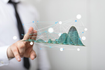 Leinwandbilder - Stock photo of a businessman interacting with a holographic 3D graph, visualizing data analysis and business growth.