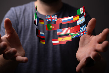 Poster - Image of hands reaching for a stream of diverse national flags, symbolizing international collaboration.