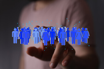 Poster - Image of a hand interacting with a digital network of people, representing global connections and community.