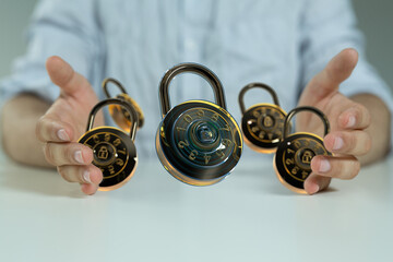 Poster - Image of hands holding multiple combination locks, symbolizing data security and protection.