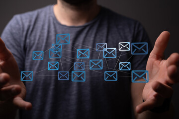 Poster - Image of a person holding a network of email icons, representing communication and connection.
