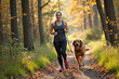 © Alex & M Studio - athletic woman jogs with her golden retriever dog on a scenic trail through an autumn forest, representing a healthy lifestyle, the joy of running, and the special bond between a pet and its owner