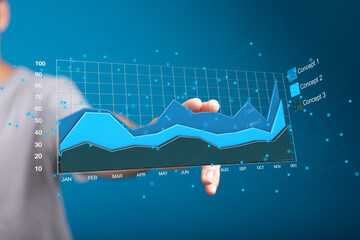 Poster - Stock photo of hand interacting with a digital graph showing business growth trends over time.