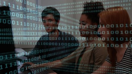 Poster - On code load developers leaning in lab typing and pointing screen for debugging with binary overlay