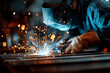 © Krissana - Industrial Worker Welding Metal with Sparks in Factory
