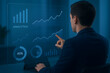 © Design Master - Man Analyzing Digital Data on Futuristic Screen