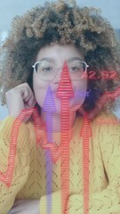 Poster - Blue and red graphs and arrows over casual businesswomen having video call in office