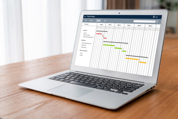 Poster - Project planning software for modish business project management on the computer screen showing timeline chart of the team project