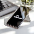 © Violet - Smartphone displaying 'no silence' on screen with plant in background