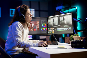 Poster - Videographer uses software to create visual effects for video projects while relaxing with some music. Professional wearing headphones using post production techniques to edit raw footage