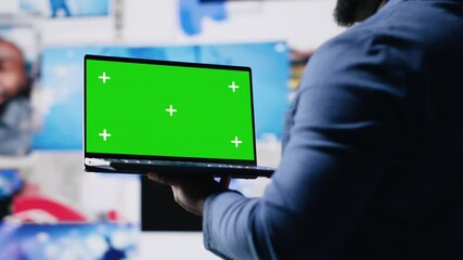 Poster - African American tech enthusiast looking at chroma key screen next to digital interfaces and multimedia visuals, showcasing content creation, mobile technology and global online influence. Camera B.