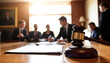 © Anuyj - Close up of a legal judges hammer with Courtroom scene, judge's gavel in foreground, wooden bench, blurred figures in background