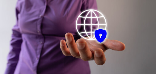 Poster - Businesswoman hand holding an internet globe icon with shield