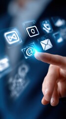 Fototapete - High-tech touchscreen device with glowing digital icons including email message envelope at front with user finger pressing icon for communication and technology innovation