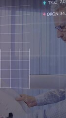 Poster - Animation of trading board and graphs over caucasian man inspecting blueprint in office