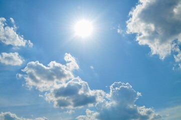 scenic view of white clouds against a bright blue sky create a serene atmosphere