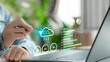 © FAMILY STOCK - Close-up of hand using pen to interact with CO2 emissions dashboard hologram, displaying eco data, cloud icon, and environmental analytics, symbolizing carbon tracking and green technology.