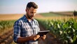 © Sunshine - A farmer stands in a cornfield using a digital tablet to monitor crop growth and manage agricultural tasks efficiently.