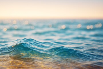 Poster - Close-up of gentle ocean waves with golden reflections and soft bokeh lights at sunset on a serene water surface background scene.