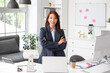 © Pixel-Shot - Young Asian businesswoman at table in office