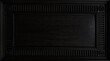 © RocknRoller Studios - Elegant Black Wooden Panel with Classic Embossed Frame Detail. Wood Texture Background with copy-space.