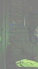 Poster - Animation of data processing over asian male hacker in server room