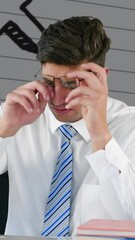 Poster - Man using laptop against mathematical symbols on white lined paper